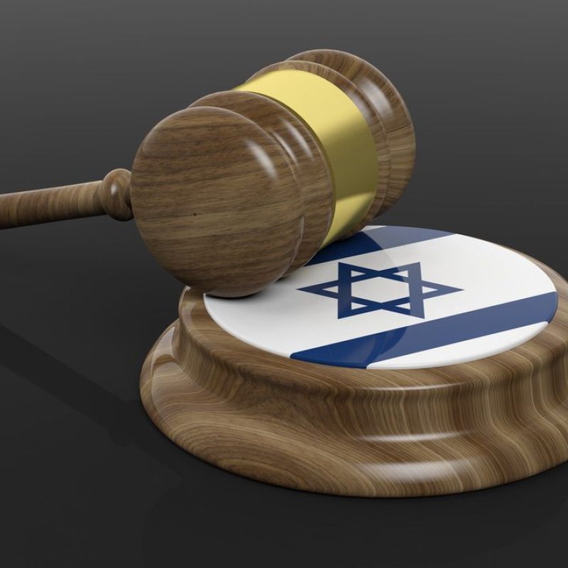 Court hammer and Israel flag on black background